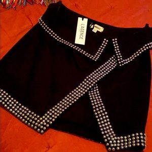 Hip hugging skirt/incredible silver hobnail trim.